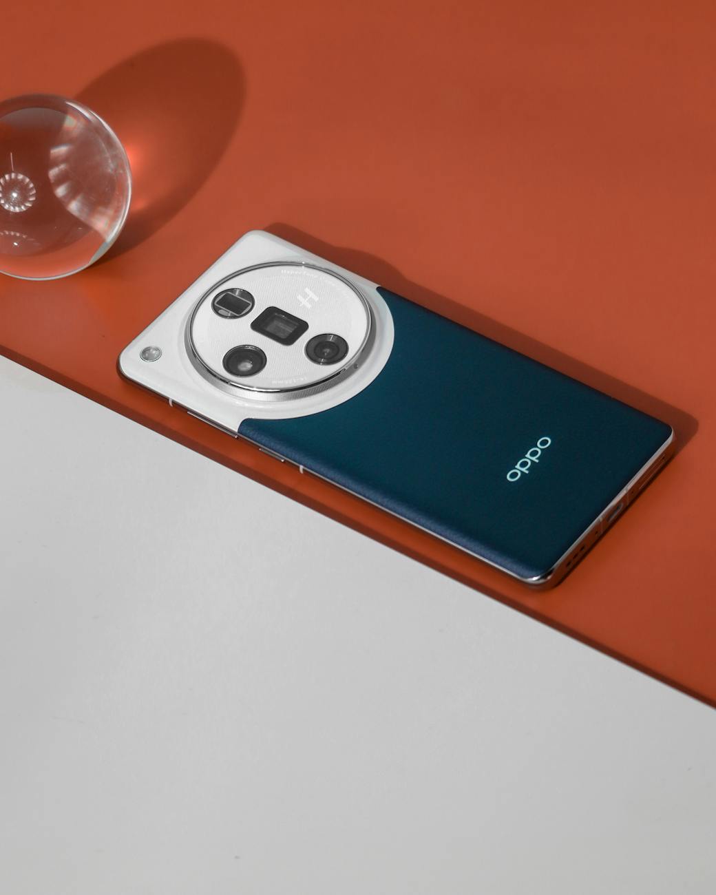 Stylized shot of a smartphone on a contrasting surface, highlighting its design and build.